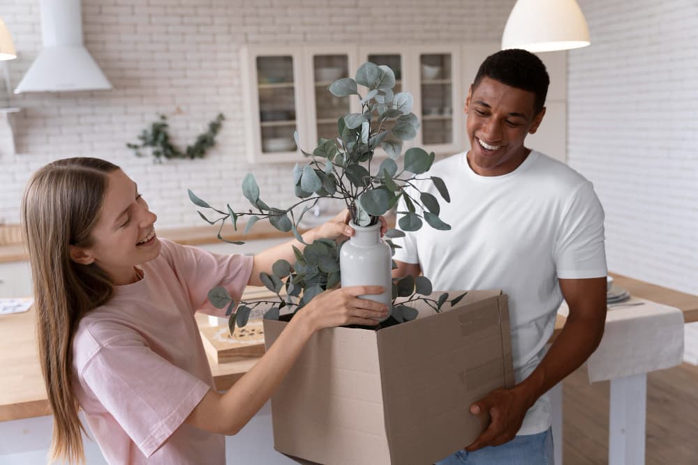 Girl placing flowers inside vase gotten from give&take